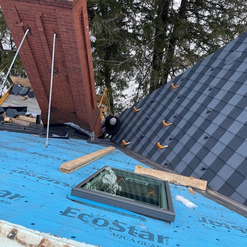 EcoStar synthetic slate roof with skylight installation EcoStar synthetic slate roof with skylight installation