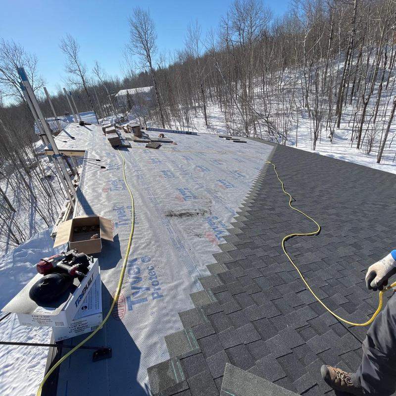 CertainTeed Landmark shingle roof installation in snow CertainTeed Landmark shingle roof installation in snow