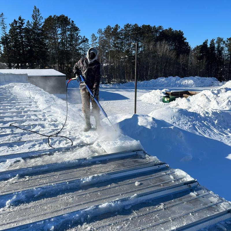 Metal roof ice dam removal with steam cleaning Metal roof ice dam removal with steam cleaning