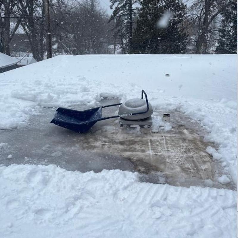 Flat roof snow and ice removal near vent pipe Flat roof snow and ice removal near vent pipe