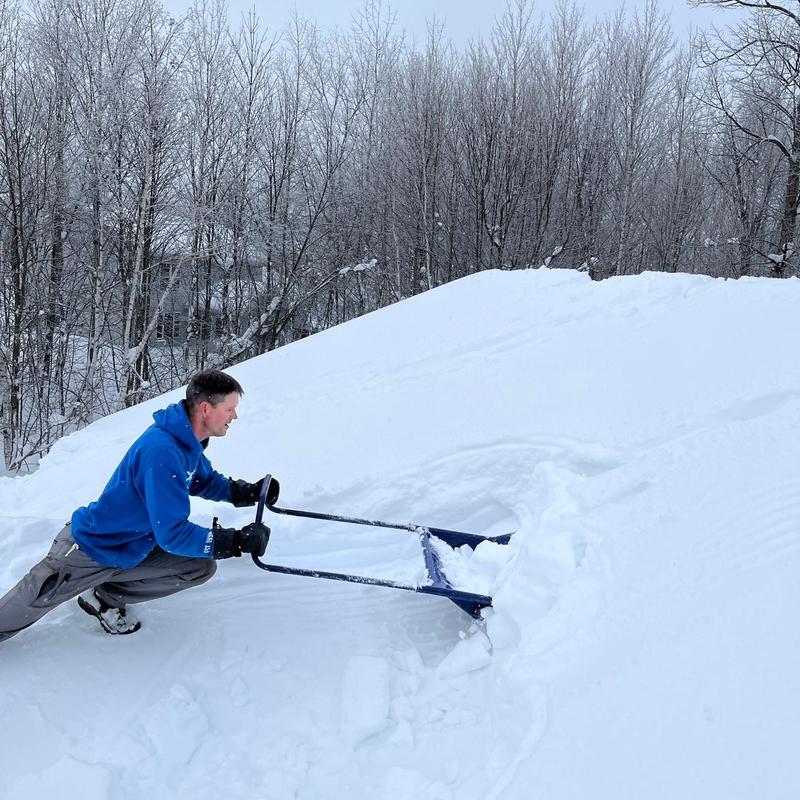 Roof snow removal on steep roof slope in winter Roof snow removal on steep roof slope in winter