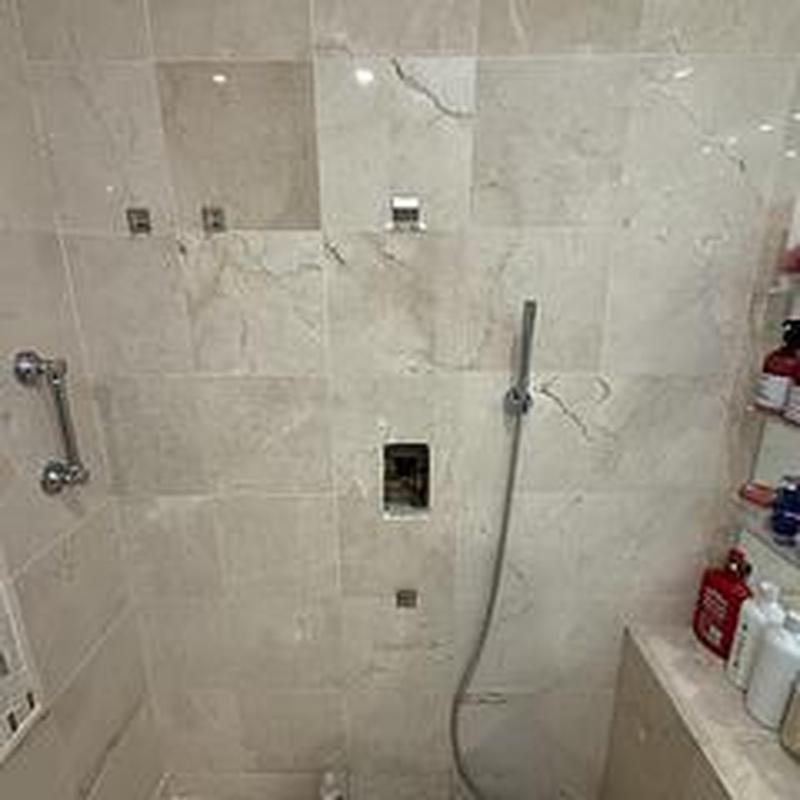 Shower valve plumbing rough-in behind tile wall