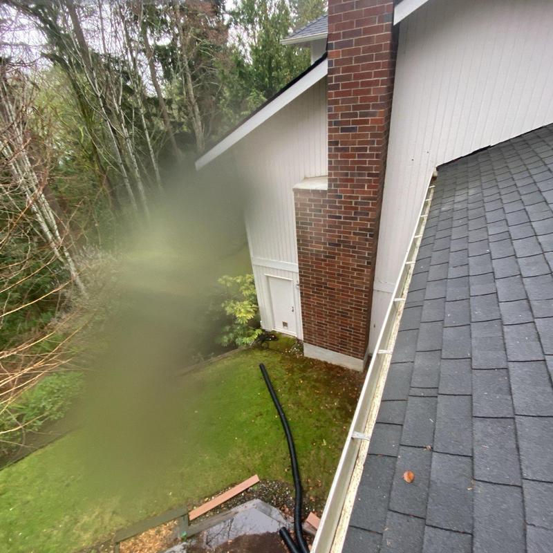Gutter and roof cleaning with debris removal
