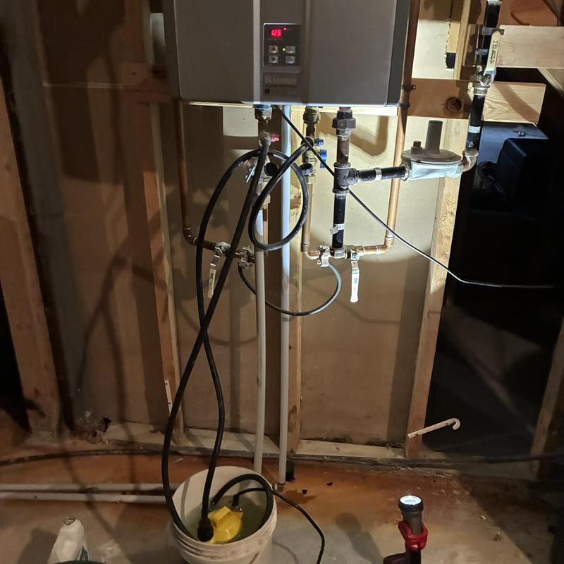 Tankless water heater maintenance with pump and bucket