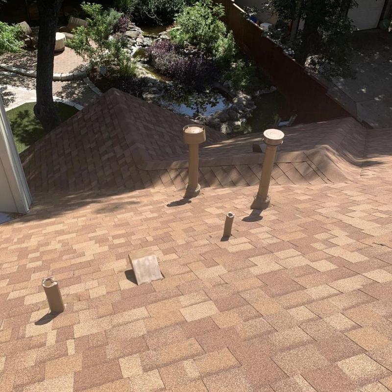 Asphalt shingle roof with lead pipe boots installation