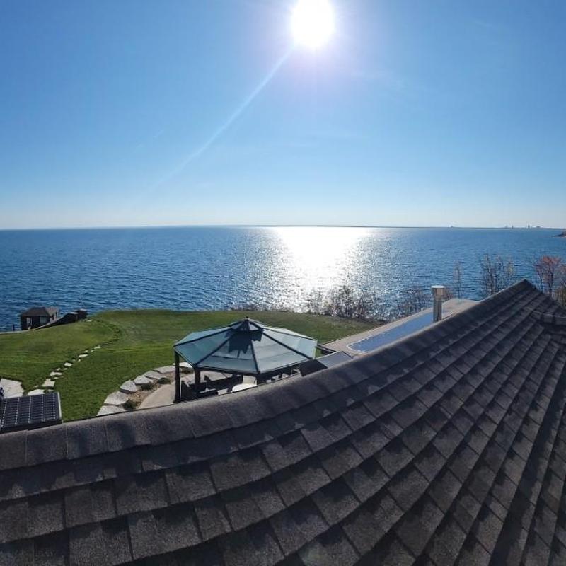 Radiant heat trace system on roof near lake view Radiant heat trace system on roof near lake view