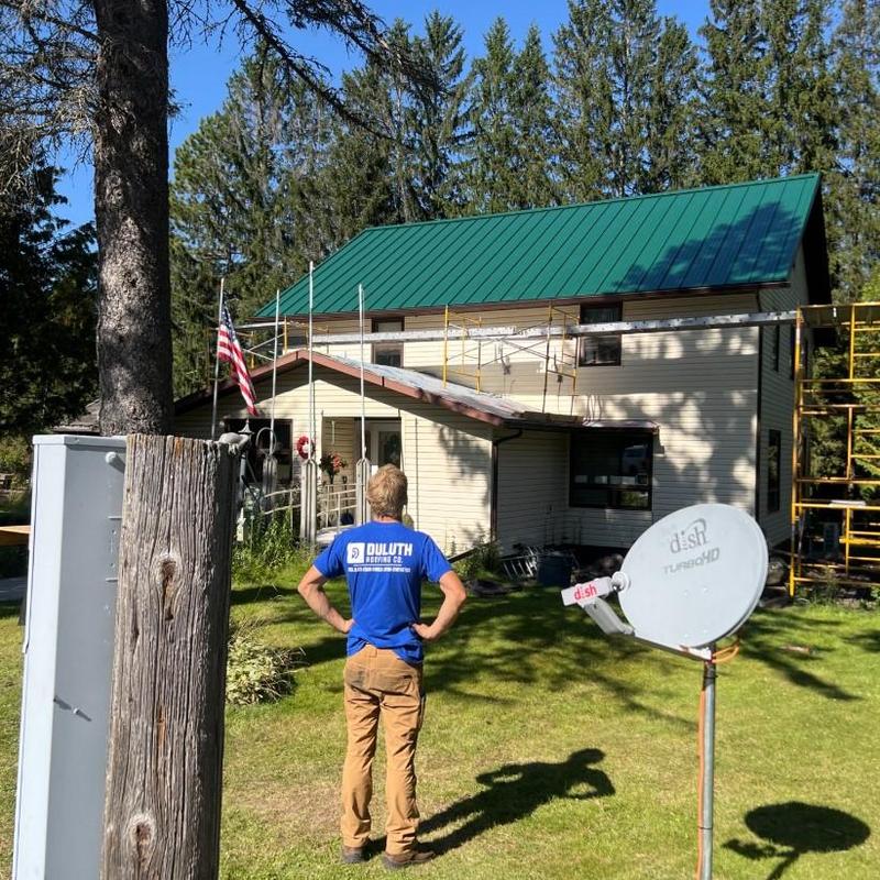 Metal Sales Image II roof with scaffolding and worker Metal Sales Image II roof with scaffolding and worker