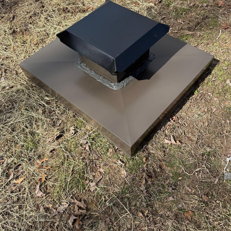 Metal roof vent flashing installed on dry grass