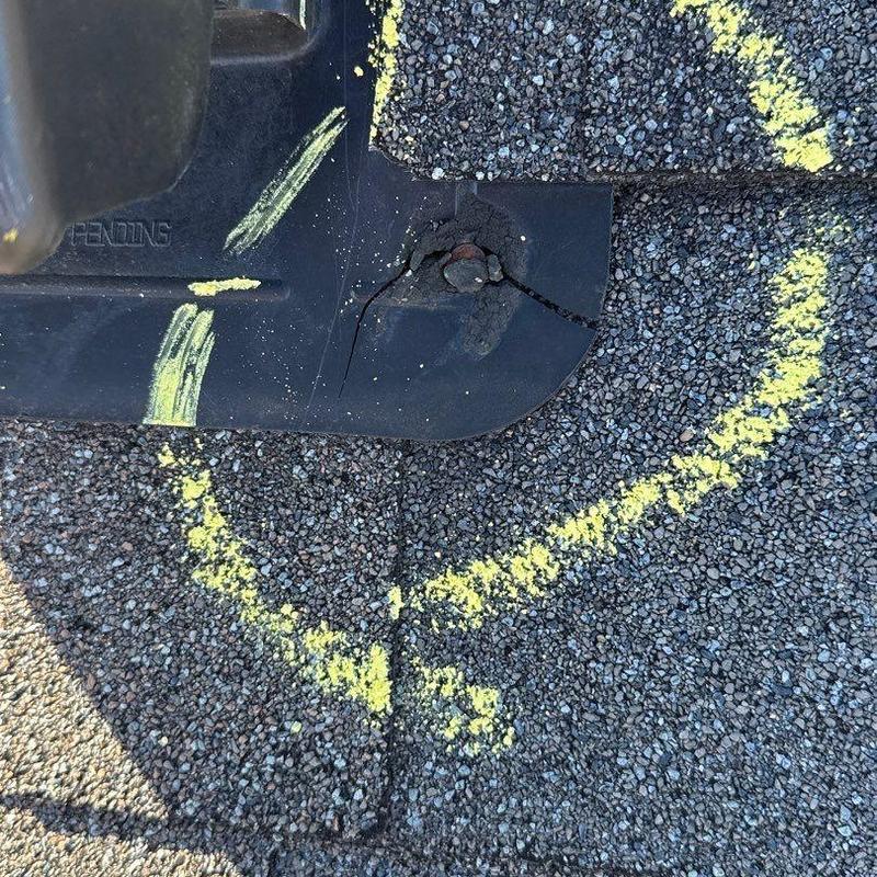 Roof flashing with cracked seal and corrosion marks
