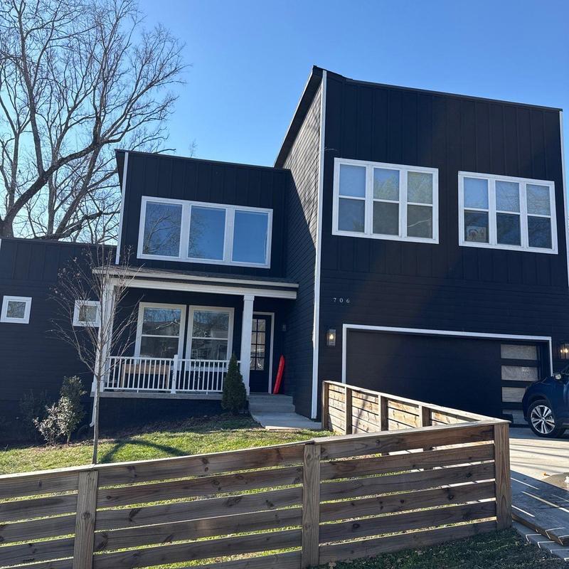 Asphalt shingle roof inspection on modern black house