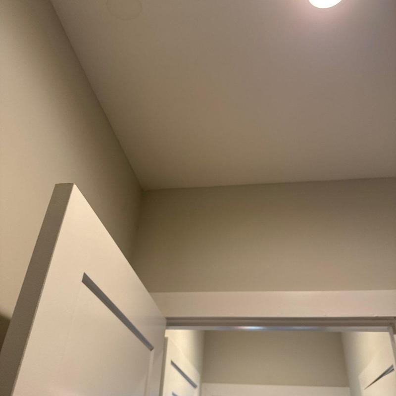 Ceiling corner and door frame with light fixture