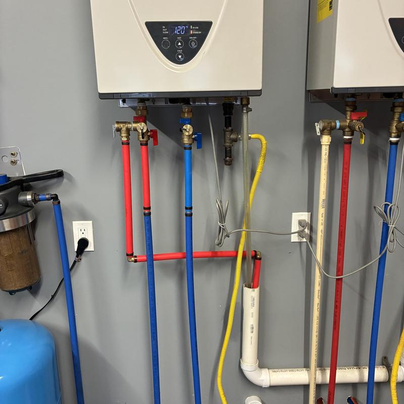 Tankless water heater isolation valve kit and piping