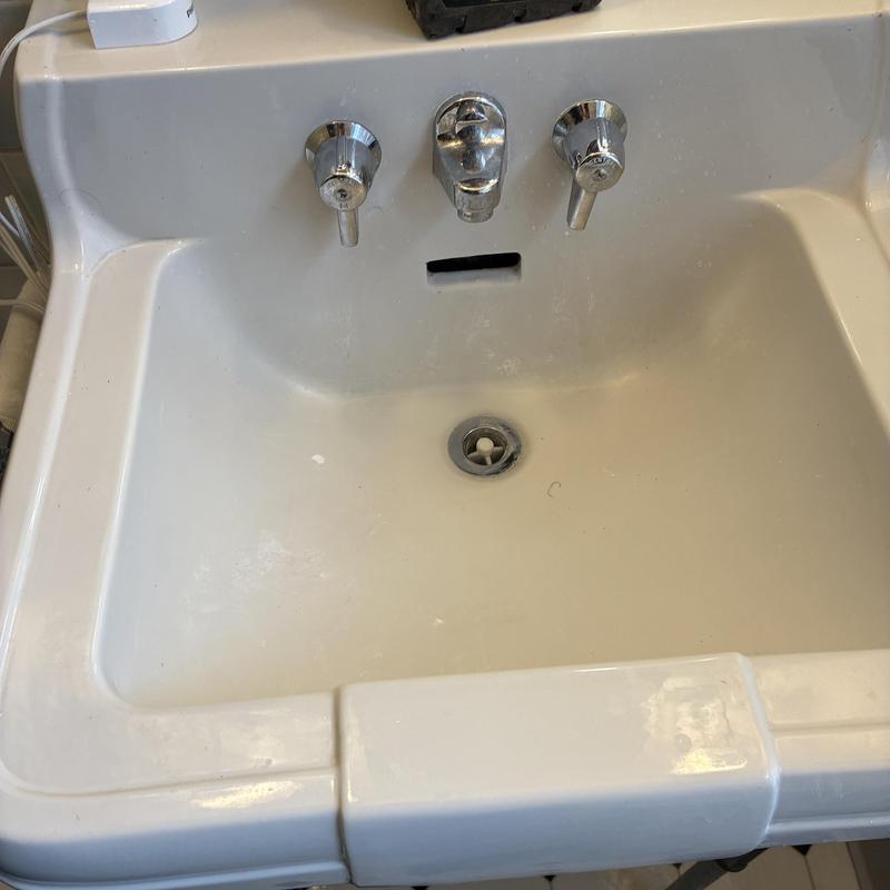 Lavatory sink drain with chrome faucet handles