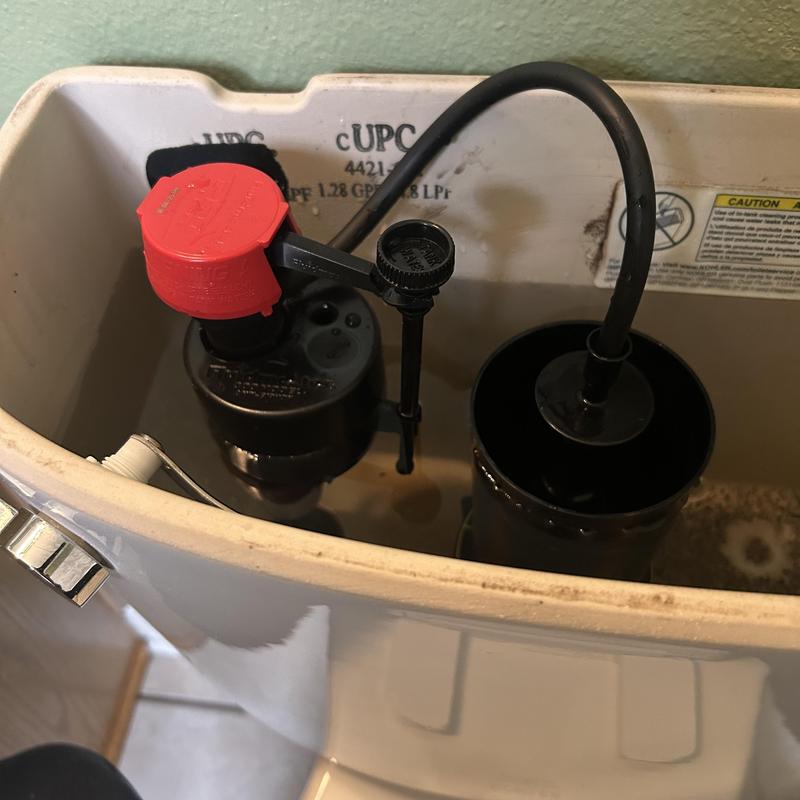 Toilet fill valve and flush valve inside tank
