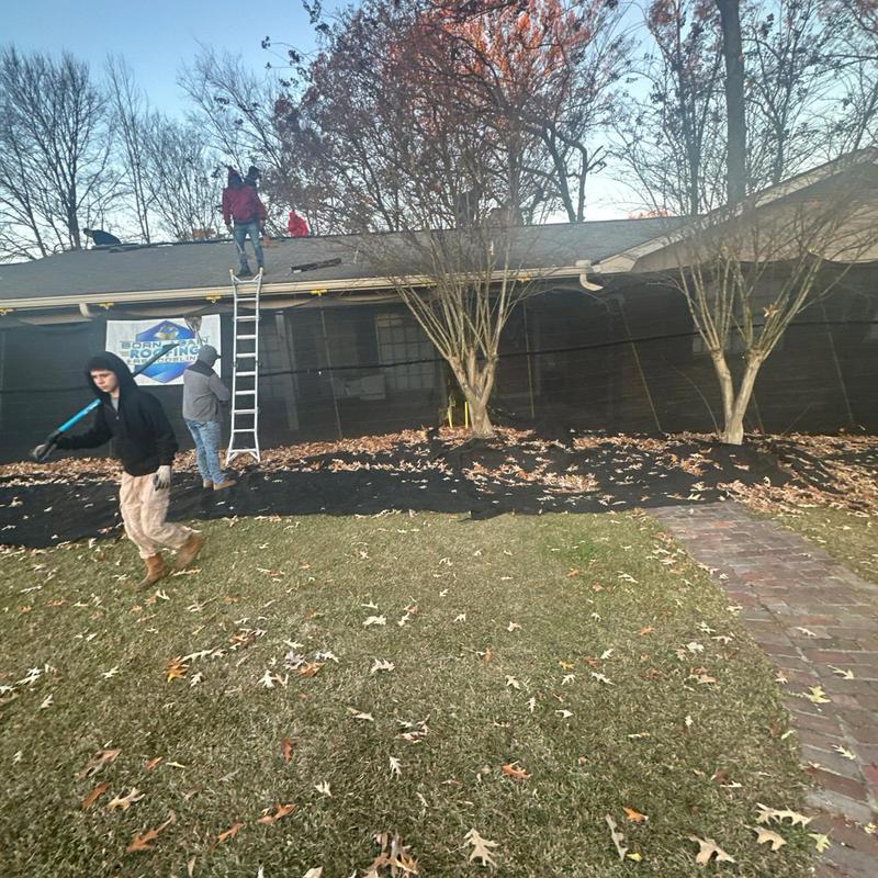 Asphalt shingle roof installation with workers and ladder Asphalt shingle roof installation with workers and ladder