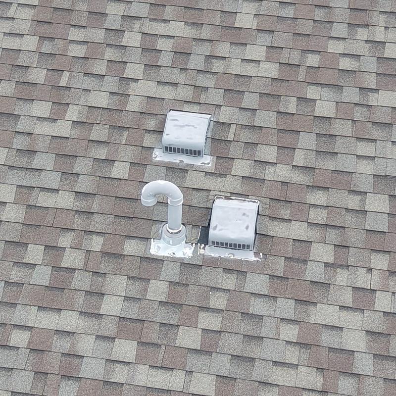 Plumbing vent and roof vents on asphalt shingle roof