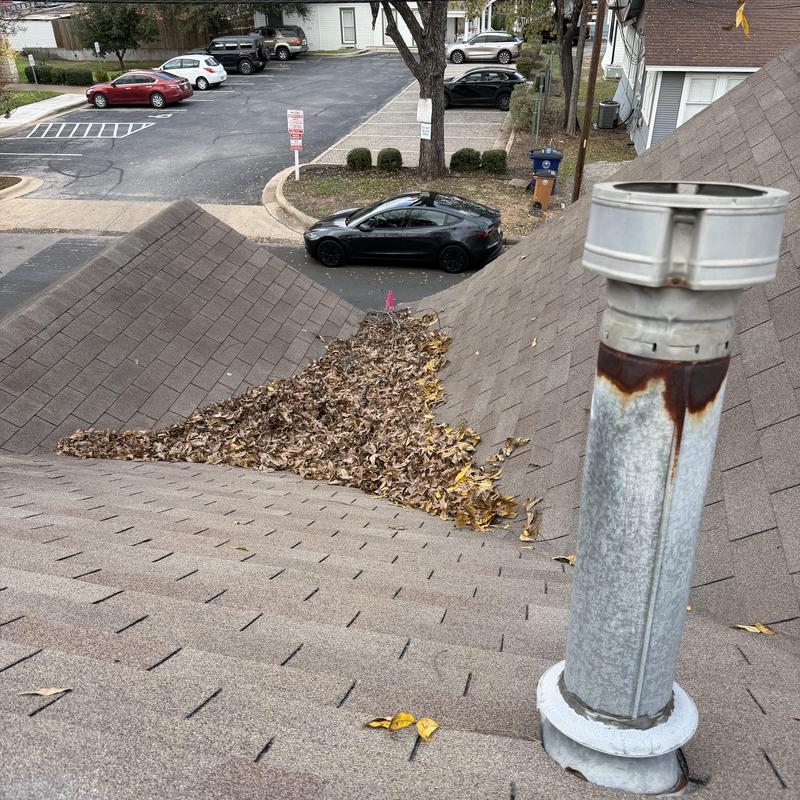 Roof valley with leaf debris causing water damming