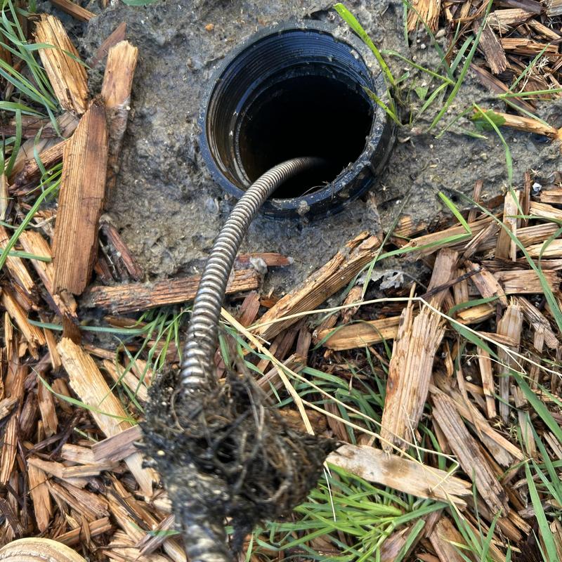 Main sewer cleanout with root clog removal cable