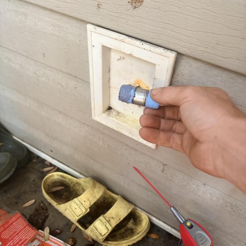 Hose bib installation with Teflon tape application