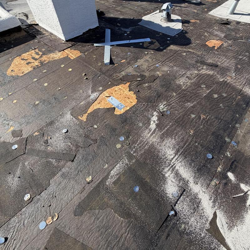 Modified bitumen roof with damaged decking exposed