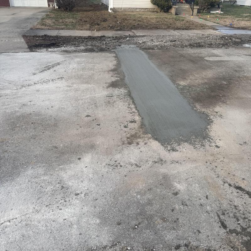 Sewer line road patch on residential street Sewer line road patch on residential street