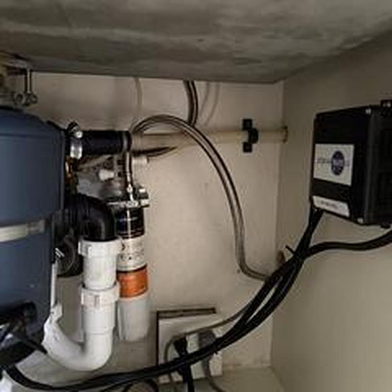 Dishwasher drain hose adjusted, water heater temp set