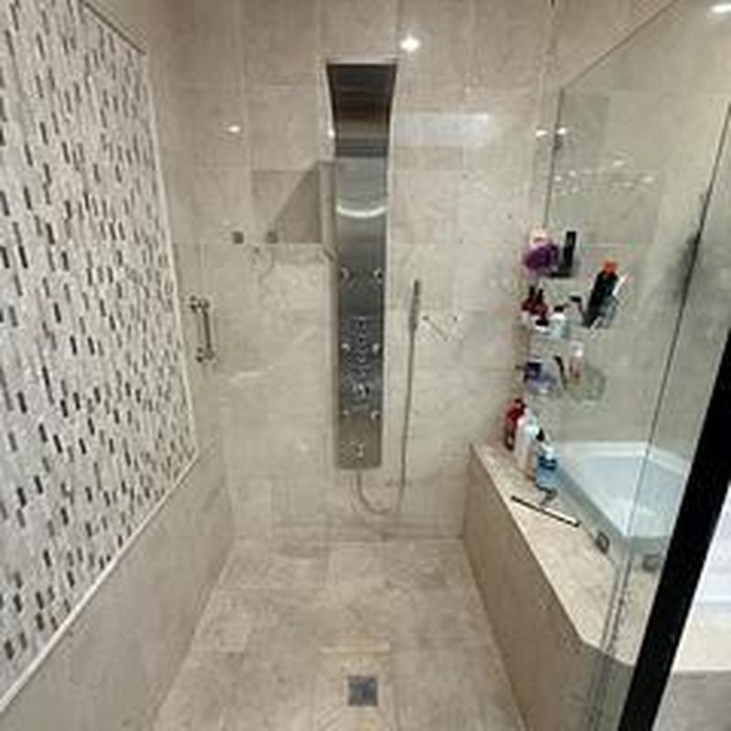 Shower tower unit installed with new brackets and caulk