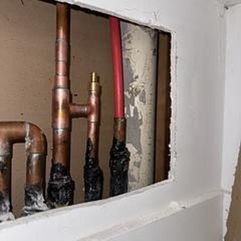 Copper and PEX hot water pipes with drywall access cutout