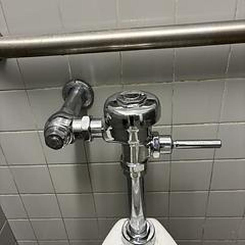 Flushometer valve on commercial toilet system