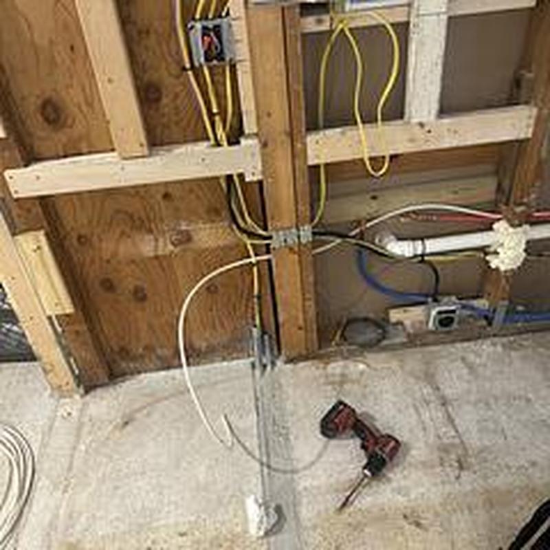 PEX icemaker line installed behind kitchen cabinet wall