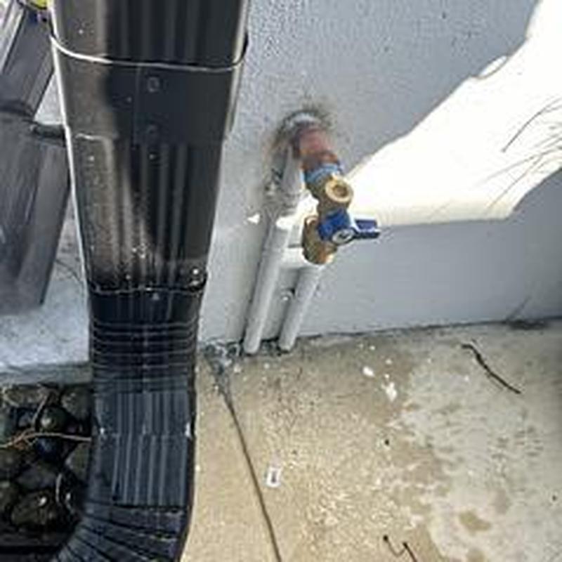 Ball valve hose bib with vacuum breaker installed outside