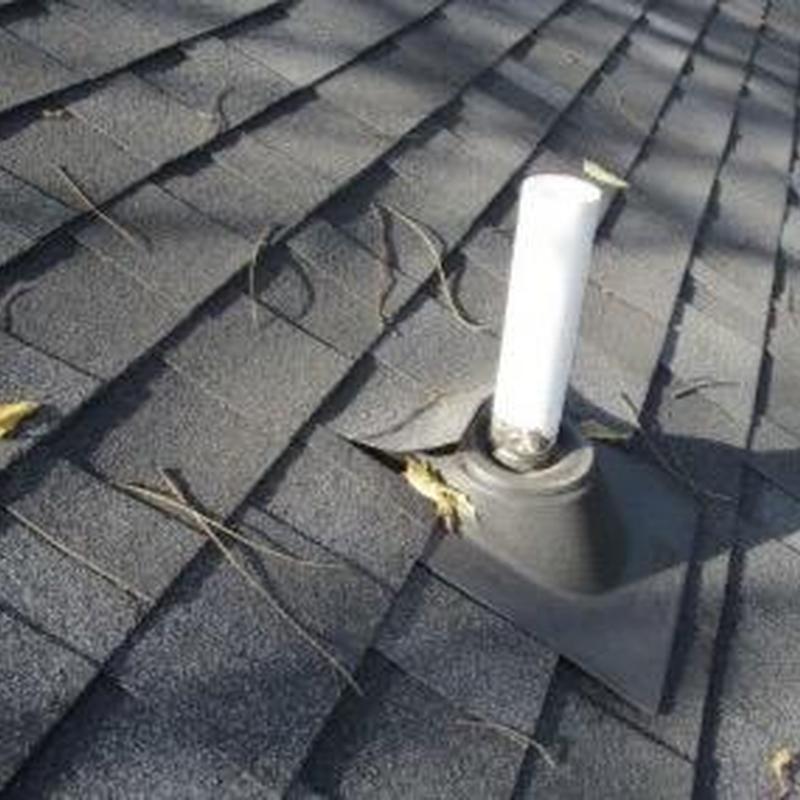 Plumbing vent pipe boot on asphalt shingle roof
