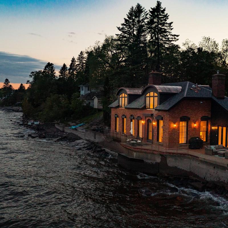 Copper flat-seam barrel roof accents with shingles Copper flat-seam barrel roof accents with shingles