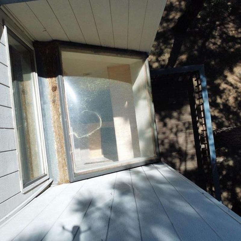 Large skylight with storm damage and framing around it
