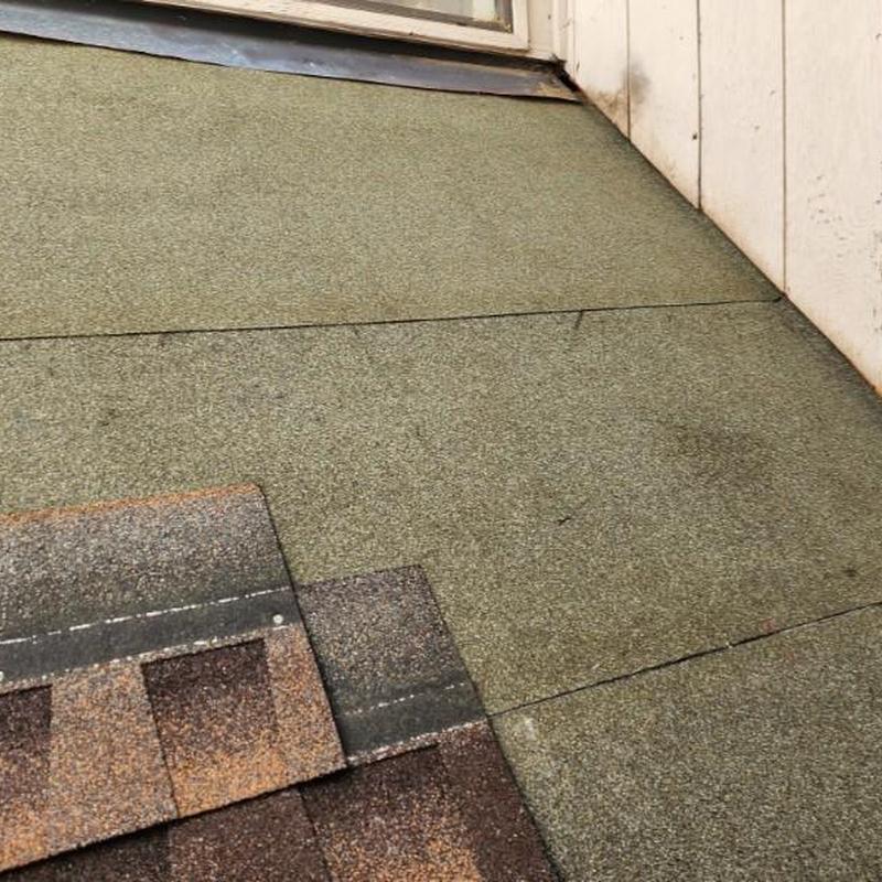 Roofing underlayment and asphalt shingles near window curb