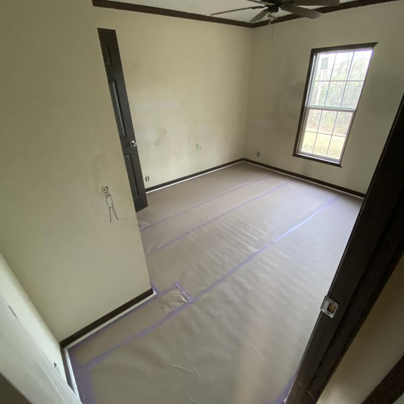 Floor covering installation for paint preparation in room Floor covering installation for paint preparation in room