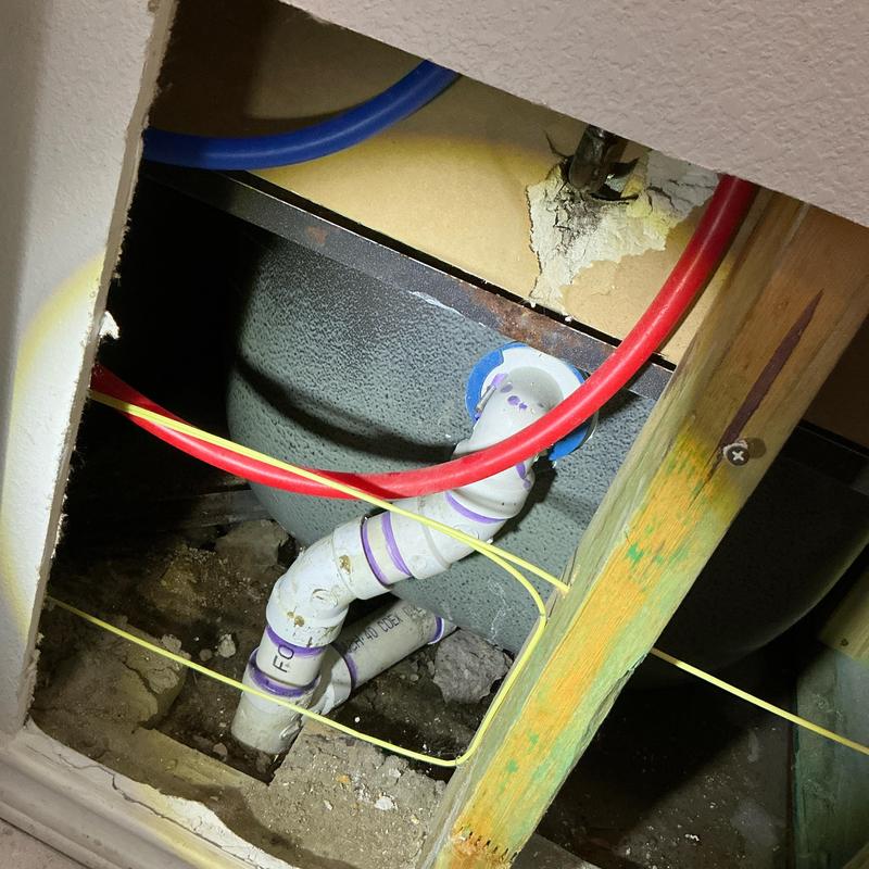 PVC drain pipes inside opened wall cavity