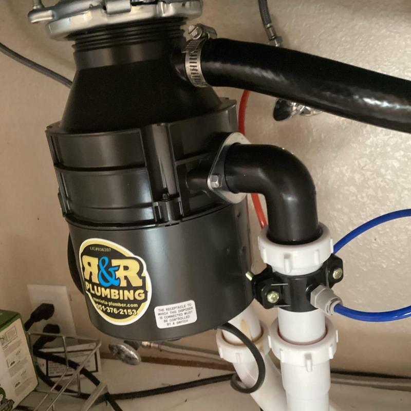 Garbage disposal unit with plumbing and electrical connections