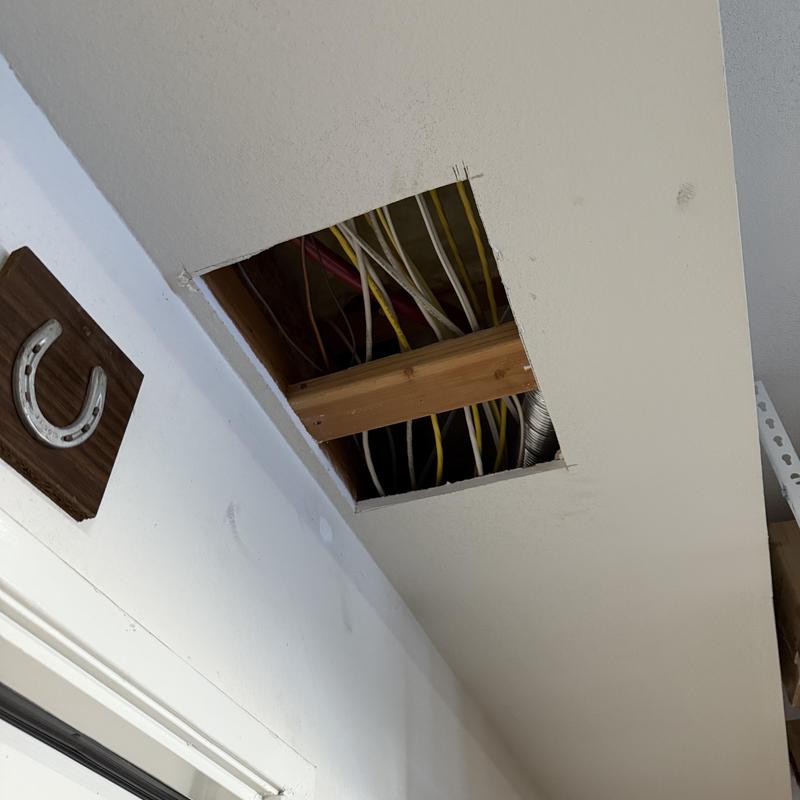 Hot water line access in ceiling drywall opening