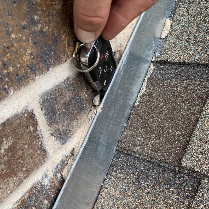 Counter flashing on brick wall roof transition gap