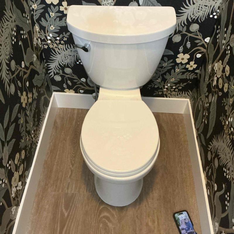 Toilet installation with new wax seal and caulking