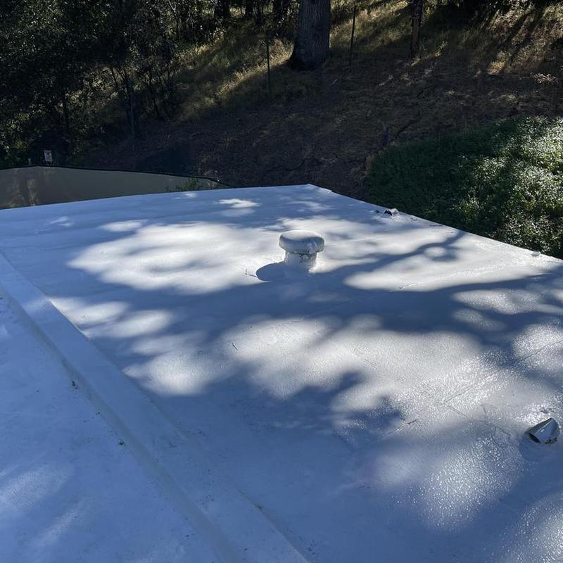 Gaf silicone flat roof with vent pipe and shadows Gaf silicone flat roof with vent pipe and shadows