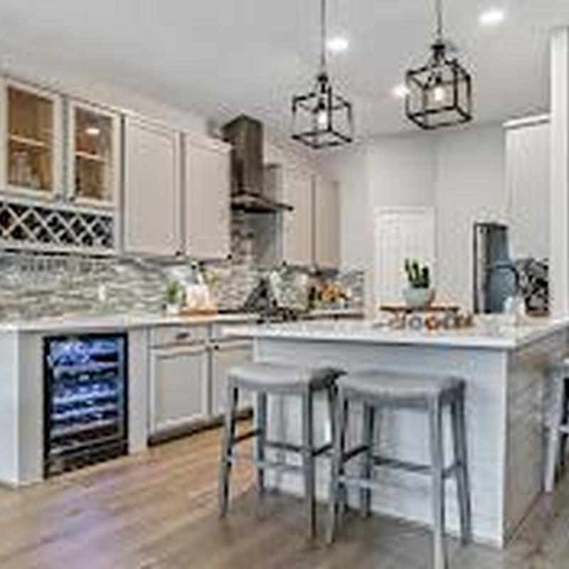 Kitchen island with bar stools and pendant lighting
