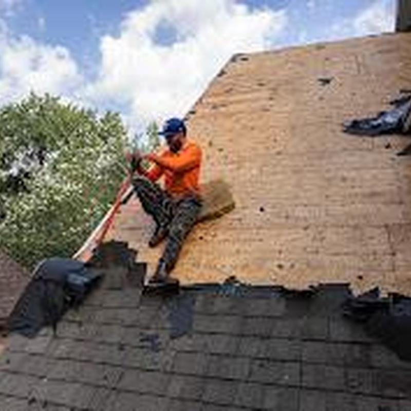 Roof decking replacement with safety harness on steep roof