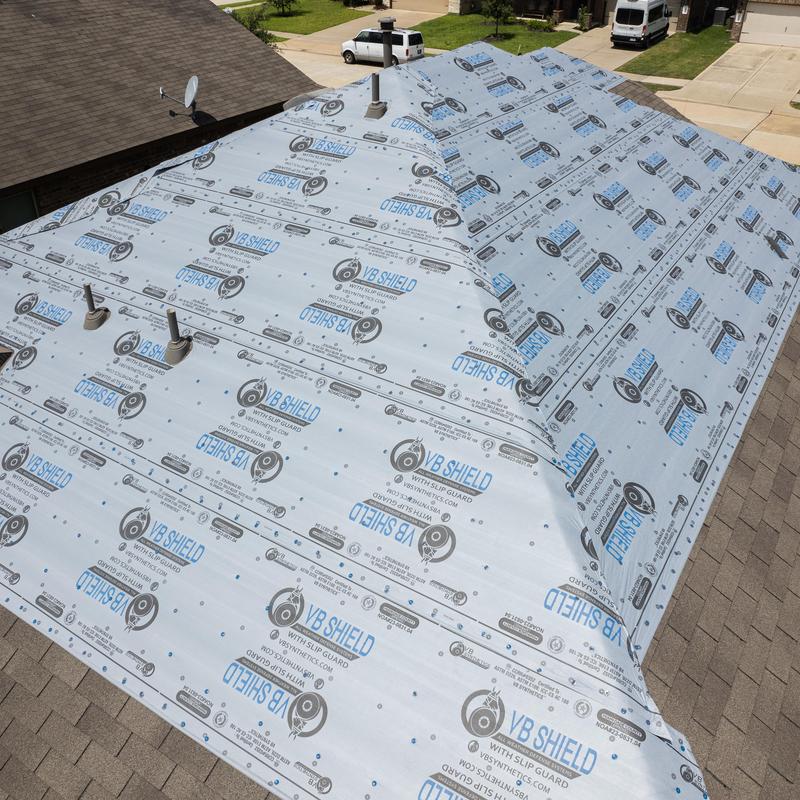 Roof underlayment installation on residential roof