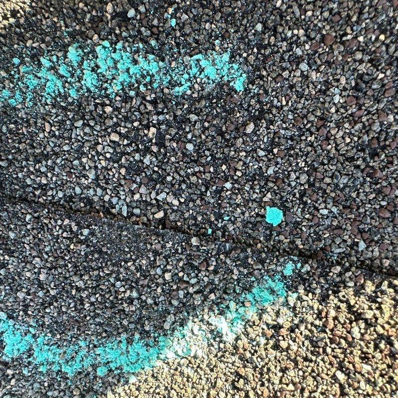 Asphalt shingle roof with hail damage markings Asphalt shingle roof with hail damage markings