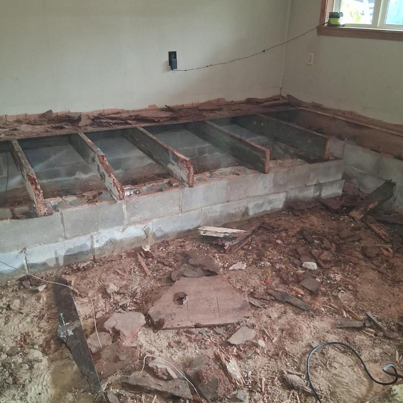 Rotten floor joists and substructure removal in room Rotten floor joists and substructure removal in room