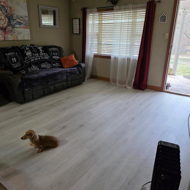 Vinyl waterproof floor installation in living room Vinyl waterproof floor installation in living room