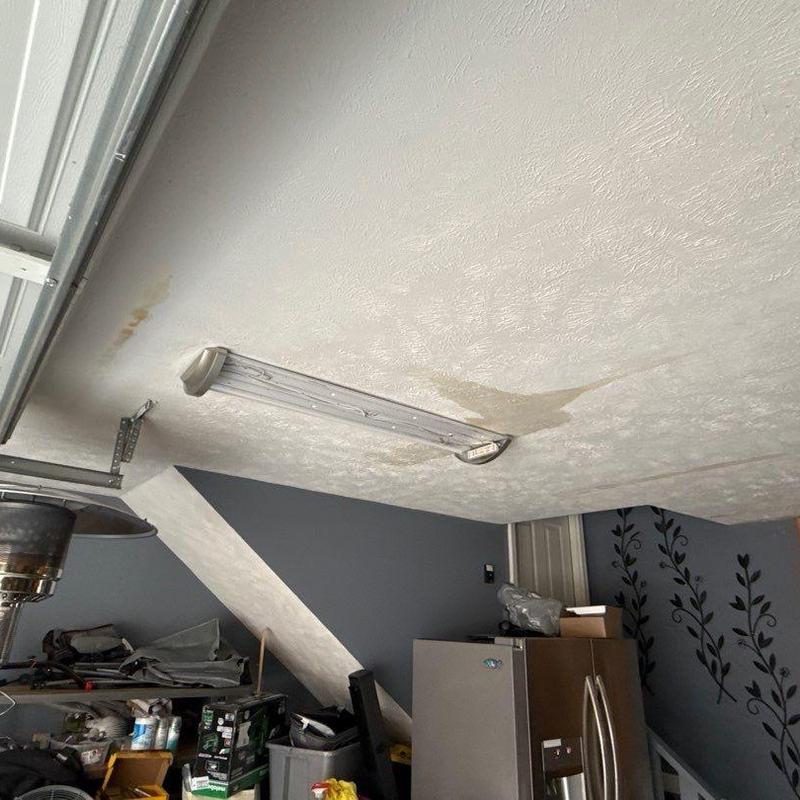 Garage ceiling with water stains near light fixture