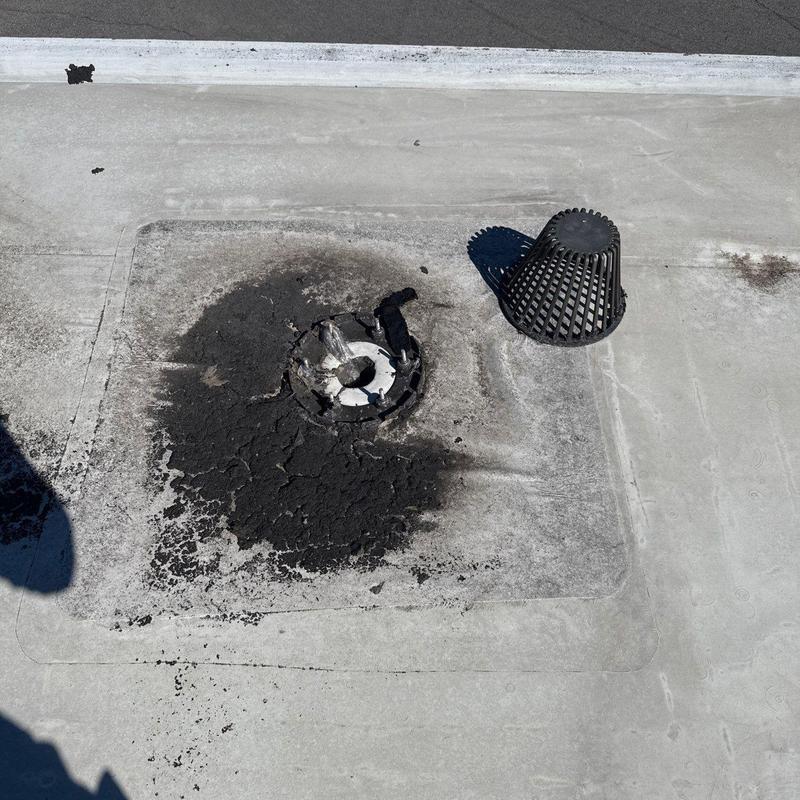 Roof drain with damaged and cracked sealant membrane